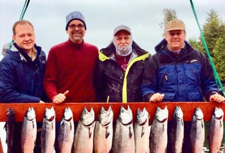 Four men with their catch of the day