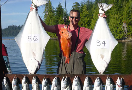 Guest shows off his salmon, rockfish and halibut catch including a 56 and 34 pound halibut.
