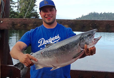 Guest shows off his silver salmon catch.