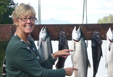 Guests points out her beautiful salmon catch.