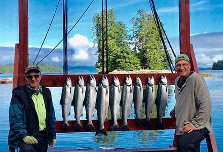 Guests pose with their silver salmon.