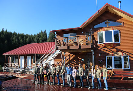 The 2016 crew lines up in front of the lodge.