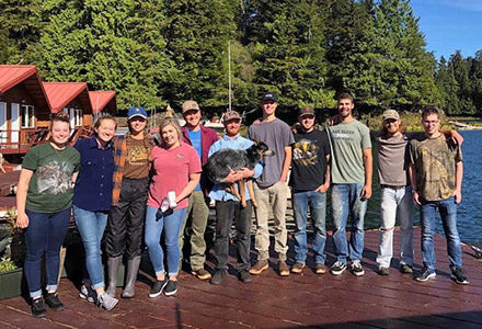 2019 Crew poses on the lodge deck.