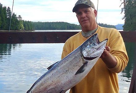 Guests holds his nice king salmon for the camera.