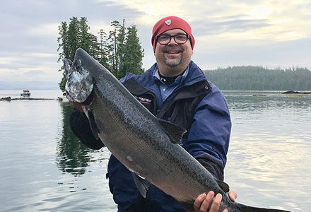 Guest proudly shows off his king salmon.