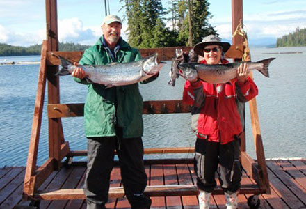Guest couple show off their king salmon catch.