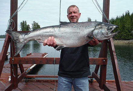Guests proudly holds his monster king salmon for the camera.