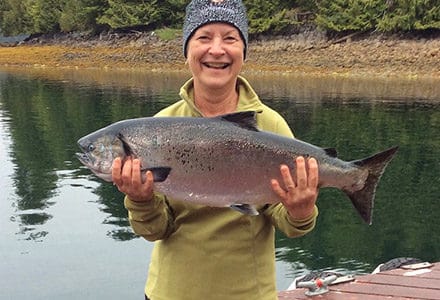 Guests holds her king salmon.