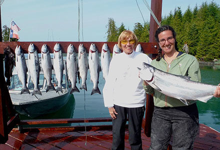 Women guests pose with their king salmon catch.
