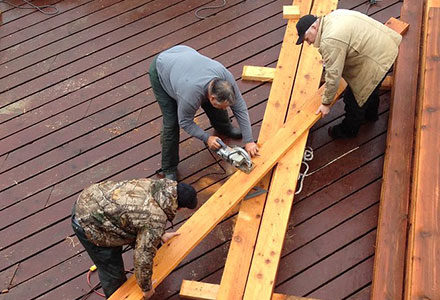 Men at work on new decking sections to prepare for the season.